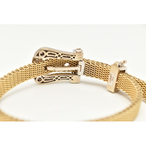 22 - A MODERN WHITE AND YELLOW METAL DIAMOND BUCKLE BRACELET, the front designed as a buckle set througho... 