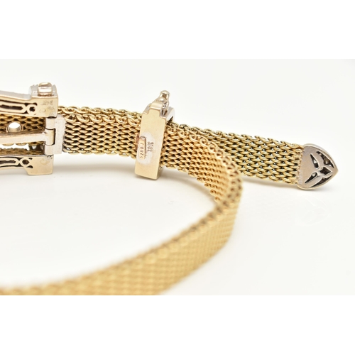 22 - A MODERN WHITE AND YELLOW METAL DIAMOND BUCKLE BRACELET, the front designed as a buckle set througho... 