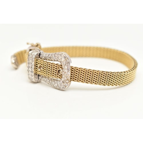 22 - A MODERN WHITE AND YELLOW METAL DIAMOND BUCKLE BRACELET, the front designed as a buckle set througho... 