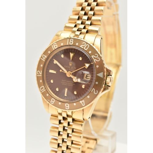 23 - A 1974 YELLOW GOLD ROLEX OYSTER PERPETUAL GMT MASTER WRISTWATCH, model number 1675, believed to be M... 