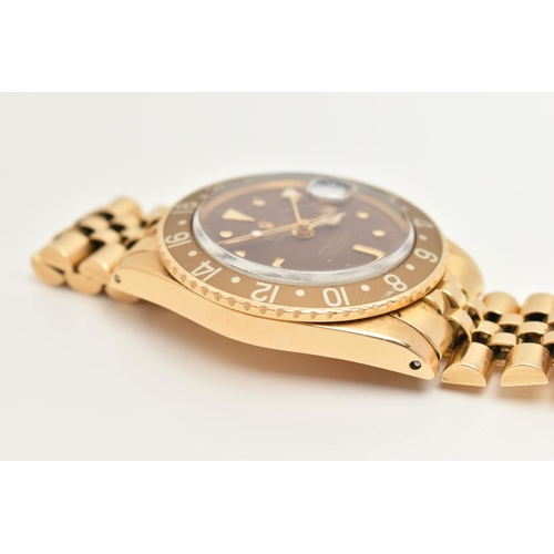 23 - A 1974 YELLOW GOLD ROLEX OYSTER PERPETUAL GMT MASTER WRISTWATCH, model number 1675, believed to be M... 