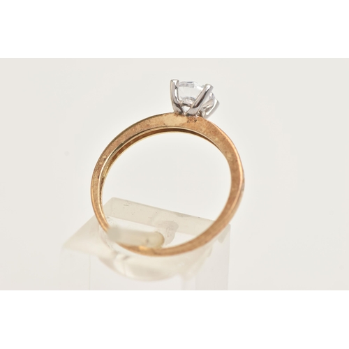 43 - A 9CT GOLD GEM SET RING, set with a central circular cut, colourless cubic zirconia, in a four claw ... 