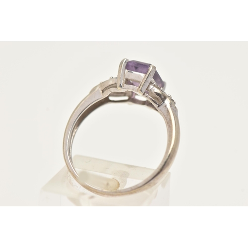 45 - A 9CT WHITE GOLD GEM SET RING, set with a central rectangular cut amethyst, flanked with small circu... 