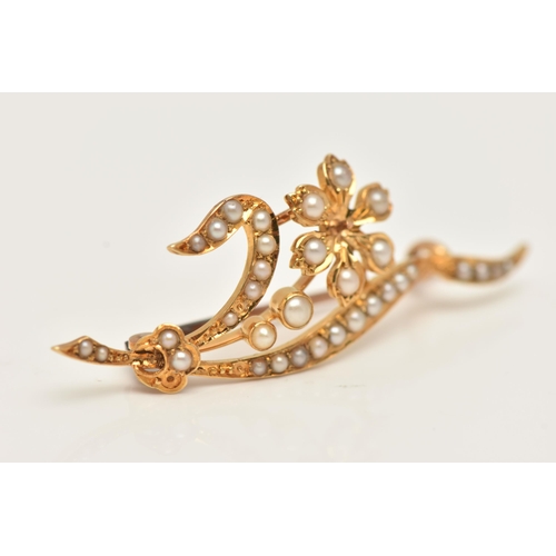 53 - AN EARLY 20TH CENTURY, YELLOW METAL SPLIT PEARL BROOCH, of a floral design, set with split pearls th... 