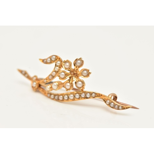 53 - AN EARLY 20TH CENTURY, YELLOW METAL SPLIT PEARL BROOCH, of a floral design, set with split pearls th... 