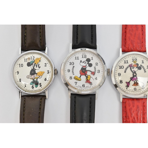 71 - FOUR WALT DISNEY WATCHES AND A CITROEN WATCH, including two Mickey Mouse wristwatches and two Minnie... 