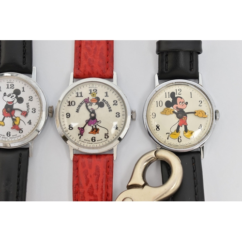 71 - FOUR WALT DISNEY WATCHES AND A CITROEN WATCH, including two Mickey Mouse wristwatches and two Minnie... 