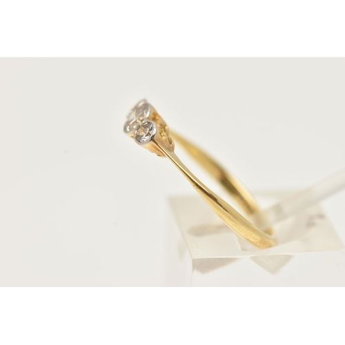 75 - A YELLOW METAL DIAMOND THREE STONE RING, three old cut diamonds, each in a collet setting, estimated... 