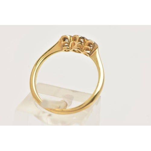 75 - A YELLOW METAL DIAMOND THREE STONE RING, three old cut diamonds, each in a collet setting, estimated... 