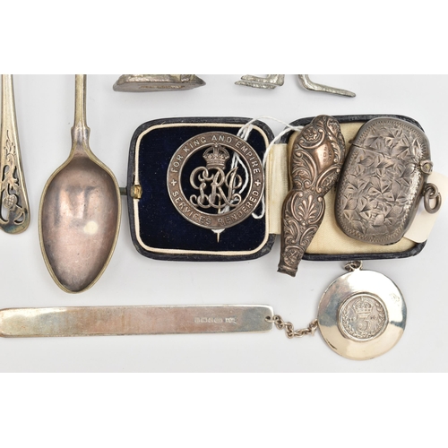 100 - AN ASSORTMENT OF SILVER AND WHITE METAL, to include a silver vesta, a silver medal, a silver book ma... 