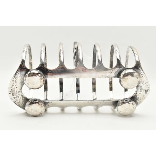 111 - A GEORGE V SILVER TOAST RACK, six slot polished toast rack, on four bun feet with loop handle, hallm... 