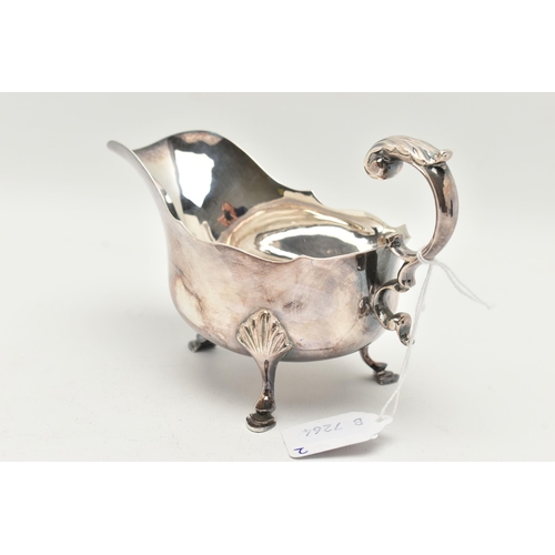 114 - AN EDWARDIAN SILVER GRAVY BOAT, of a polished form with wavy rim, raised on three hoof feet with she... 