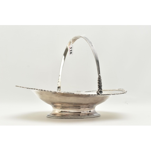 116 - AN EDWARDIAN SILVER FRUIT BASKET, of an oval form gadrooned and shell pattern rim, with handle, on a... 