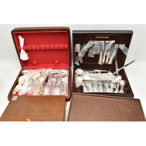 129 - FOUR WOODEN CASED CANTEENS, two containing most of the canteen set, two with partial sets