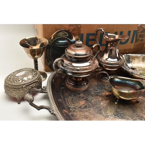 130 - TWO BOXES OF SILVER PLATED WARE, to include a hand chased EPC plated four piece tea service, a cande... 