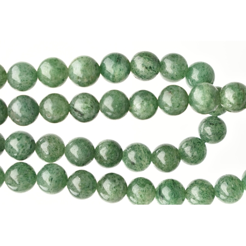 89 - TWO GEMSTONE BEADED NECKLACES, the first a malachite necklace, designed as graduated beads, fitted w... 