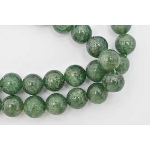 89 - TWO GEMSTONE BEADED NECKLACES, the first a malachite necklace, designed as graduated beads, fitted w... 