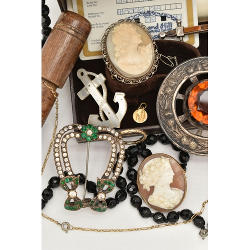 96 - A BOX OF ASSORTED ITEMS, to include two cameo brooches, a Scottish Cairngorm brooch, a Scottish dagg... 