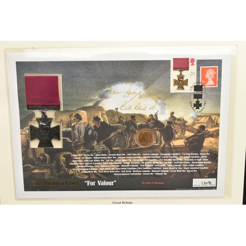 161 - THE HISTORY OF WWII COIN/ STAMP ALBUM, to include a copy of the Victoria Cross together with a Victo... 