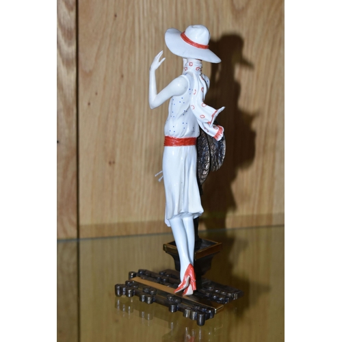 320 - AN ALBANY FINE CHINA ART DECO STYLE FIGURINE, titled Chelsea stood before a bronzed metal stylised t... 