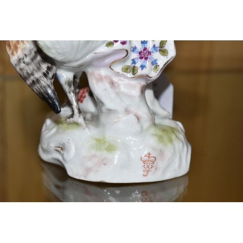 321 - A NINETEENTH CENTURY CONTINENTAL PORCELAIN FIGURE, depicting Juno with Peacock and a lizard climbing... 