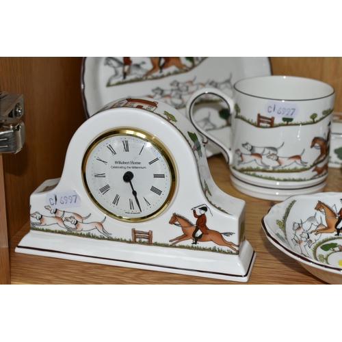 324 - A GROUP OF WEDGWOOD 'HUNTING SCENES' PATTERN GIFTWARE, comprising two mugs, a Robert Horne mantel cl... 