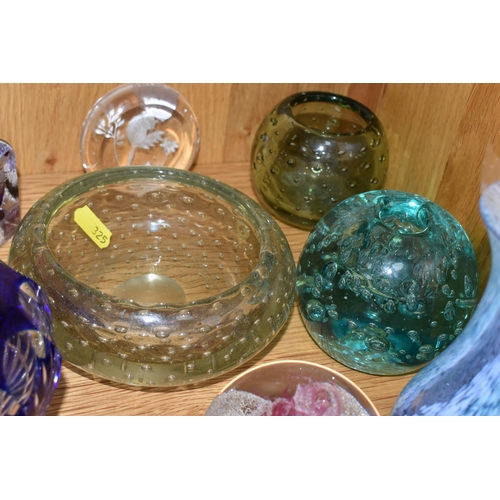 325 - A COLLECTION OF COLOURED GLASS AND PAPERWEIGHTS, comprising a green 'Dump Glass' paperweight, a Cait... 