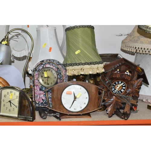 340 - A LARGE QUANTITY OF ASSORTED CLOCKS AND TABLE LAMPS, comprising a modern Swiss made cuckoo clock by ... 