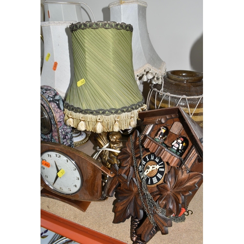 340 - A LARGE QUANTITY OF ASSORTED CLOCKS AND TABLE LAMPS, comprising a modern Swiss made cuckoo clock by ... 