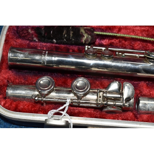 348 - A BOOSEY & HAWKES OF LONDON THREE PIECE FLUTE, comprising a red lined case with original key, serial... 