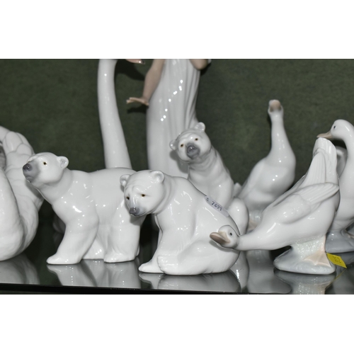 352 - A GROUP OF LLADRO AND NAO FIGURES, comprising Lladro: Swan with wings spread, no 5231, issued 1984-2... 