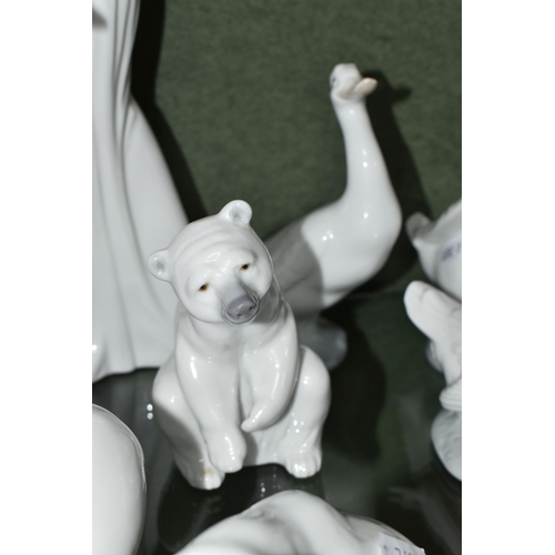 352 - A GROUP OF LLADRO AND NAO FIGURES, comprising Lladro: Swan with wings spread, no 5231, issued 1984-2... 