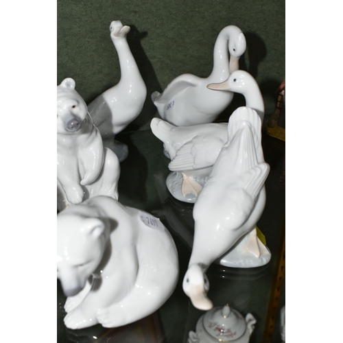 352 - A GROUP OF LLADRO AND NAO FIGURES, comprising Lladro: Swan with wings spread, no 5231, issued 1984-2... 