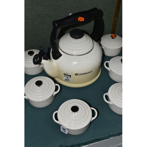 357 - A LE CREUSET KETTLE AND INDIVIDUAL CASSEROLE DISHES, in cream, comprising 2.1 litre stove top kettle... 