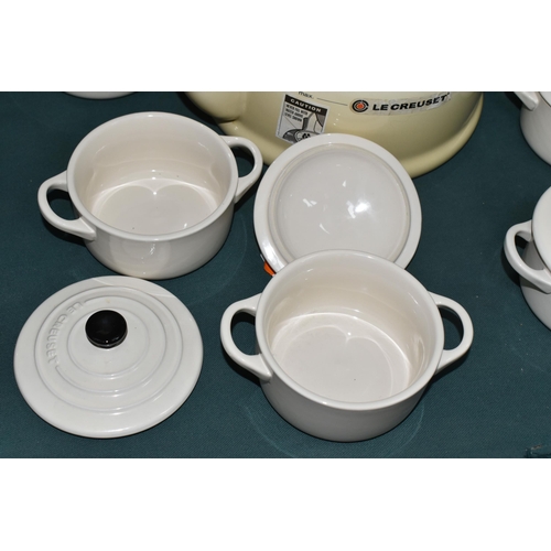 357 - A LE CREUSET KETTLE AND INDIVIDUAL CASSEROLE DISHES, in cream, comprising 2.1 litre stove top kettle... 