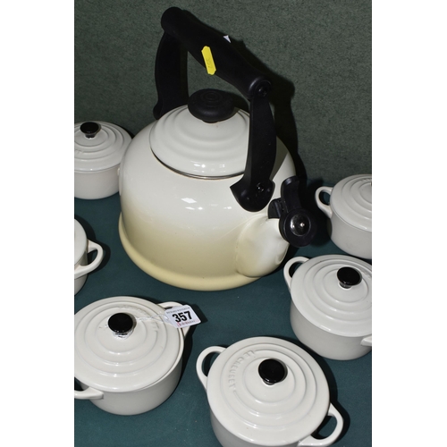 357 - A LE CREUSET KETTLE AND INDIVIDUAL CASSEROLE DISHES, in cream, comprising 2.1 litre stove top kettle... 