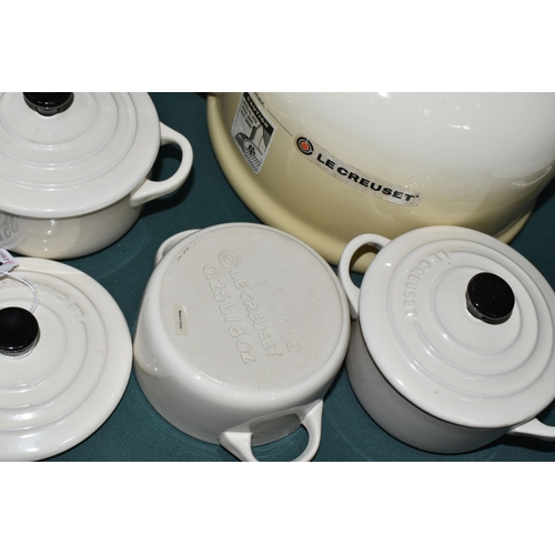 357 - A LE CREUSET KETTLE AND INDIVIDUAL CASSEROLE DISHES, in cream, comprising 2.1 litre stove top kettle... 