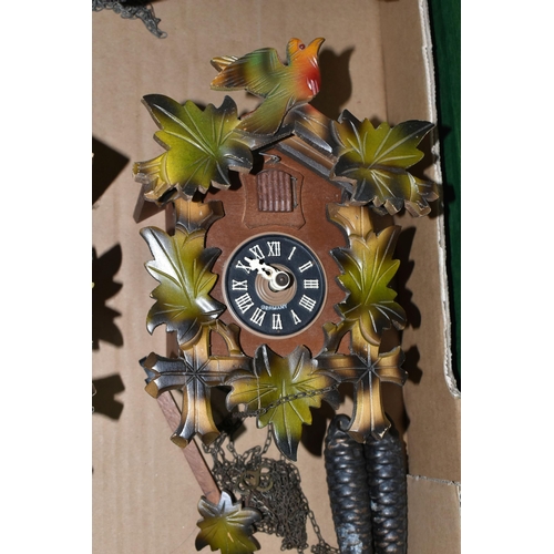 370 - ONE BOX CONTAINING THREE CUCKOO CLOCKS, comprising a brown Bakelite Russian made cuckoo clock made b... 