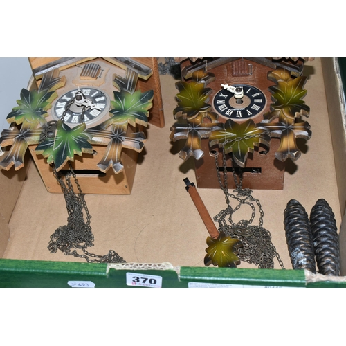 370 - ONE BOX CONTAINING THREE CUCKOO CLOCKS, comprising a brown Bakelite Russian made cuckoo clock made b... 