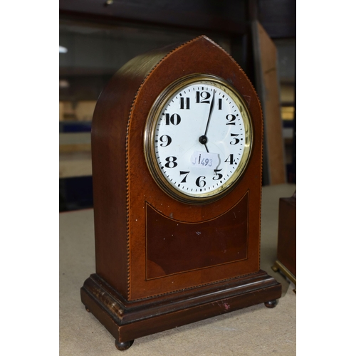 410 - TWO WOODEN CASED MANTEL CLOCKS, one of arched form, with white enamel dial marked with black Arabic ... 