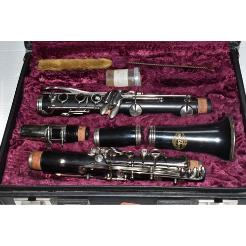 450 - A CASED CORTON BY AMATI CLARINET and two course books comprising a Corton wood and metal clarinet ma... 