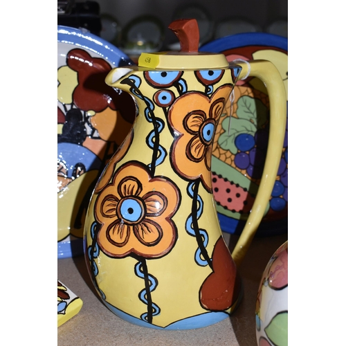 458 - A LARGE GROUP OF HANDPAINTED POTTERY, most pieces are stamped on the bottom with the signature Ellie... 