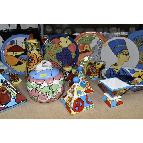 458 - A LARGE GROUP OF HANDPAINTED POTTERY, most pieces are stamped on the bottom with the signature Ellie... 