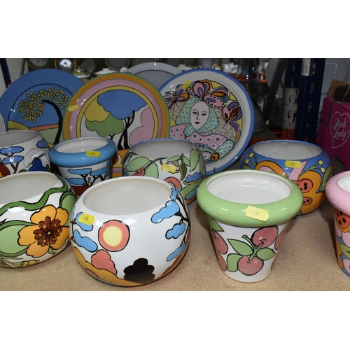 458 - A LARGE GROUP OF HANDPAINTED POTTERY, most pieces are stamped on the bottom with the signature Ellie... 