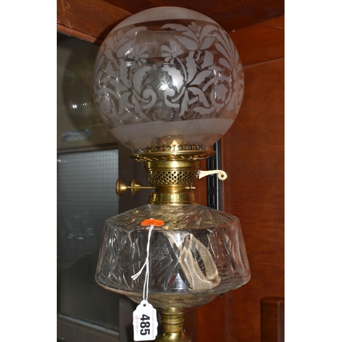 485 - A CUT GLASS AND BRASS OIL LAMP, with cut glass reservoir, brass twist column and base, etched shade ... 