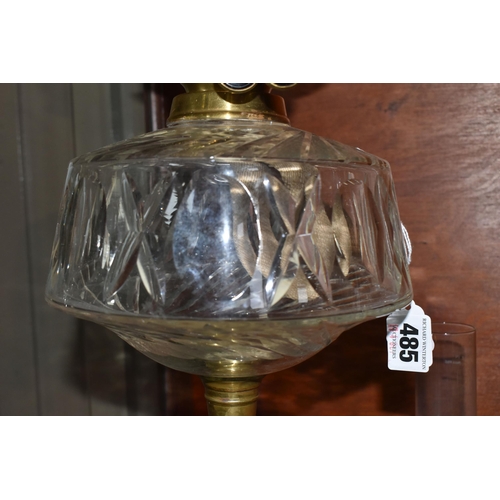 485 - A CUT GLASS AND BRASS OIL LAMP, with cut glass reservoir, brass twist column and base, etched shade ... 