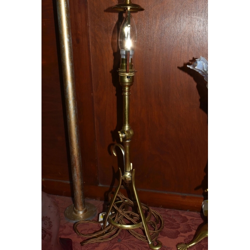 493 - TWO BRASS TABLE LAMPS AND LAMPSHADES ETC, comprising two brass three footed table lamps, tallest 52c... 