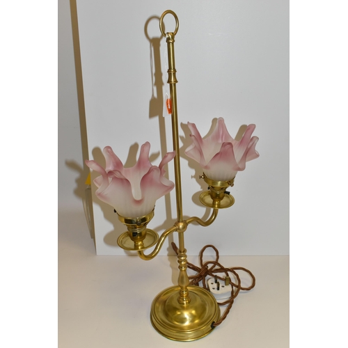 496 - A BRASS BOUDOIR TABLE LAMP, with two Art Deco style frosted white and pink glass shades, appears to ... 