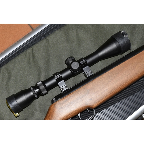 499 - A SMK 19-18 .22 BREAK BARREL AIR RIFLE, no visible serial number, fitted with a Righter Optik 3-9x40... 