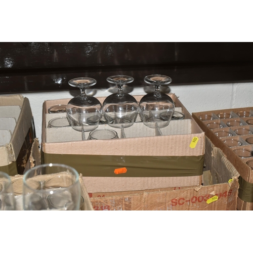 502 - TWELVE BOXES OF MOSTLY RAVENHEAD WHOLESALE GLASSES to include wine glasses, brandy glasses, aperitif... 